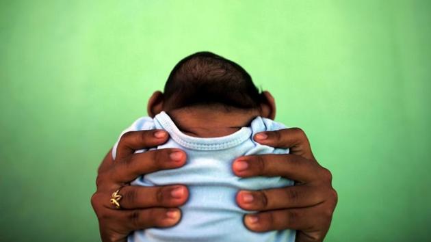 Jackeline Vieira de Souza, 26, holds her four-month-old son Daniel who was born with microcephaly at their house in Olinda. Jackeline fought to overcome a very rare complication from an earlier pregnancy, and then survived cancer. “My dream was to be a mother again. When he was born, I fell in love with him because I knew he would be a good thing in my life, even with the difficulties I would have to face.” she said. (Nacho Doce / REUTERS)