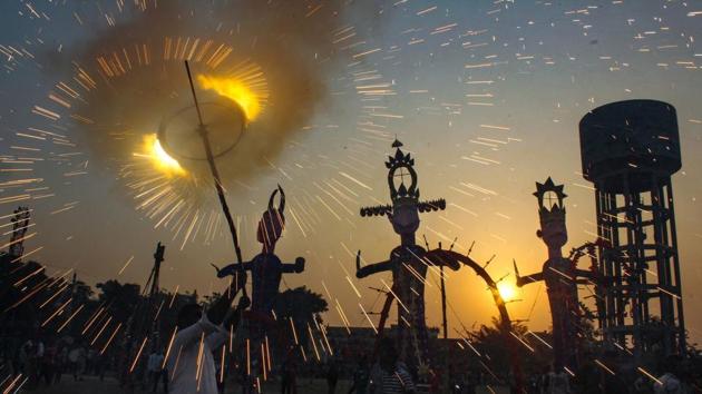 Firecrackers burst near the effigies of demon king Ravana, Meghnad and Kumbhkaran before they were set on fire in Bathinda. (PTI) Firecrackers burst near the effigies of demon king Ravana, Meghnad and Kumbhkaran before they were set on fire in Bathinda. (PTI)