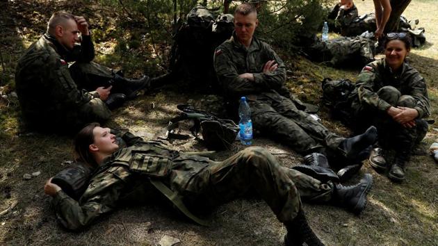 Pawlik and other territorial soldiers takes a break during training. So far, Poland’s WOT force has only participated in one major effort: a search through forests in parts of Poland for animals that died because of African swine fever. It’s a highly contagious disease that affects pigs and wild boar and has been spreading in eastern Europe in recent years. (Kacper Pempel / REUTERS)