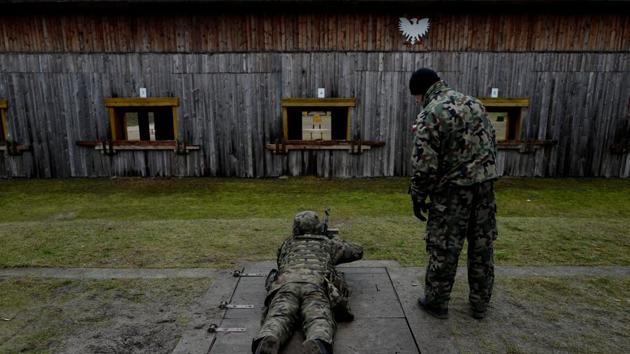 A commander instructs a recruit at a shooting range. Poland’s military planners launched WOT in 2017, just over a year after the nationalist Law and Justice (PiS) party came to power in October 2015. Its creator, Antoni Macierewicz, who was defence minister at the time, argued the formation was needed because of a growing threat from Russia and as a way to bolster patriotism among young people. (Kacper Pempel / REUTERS)