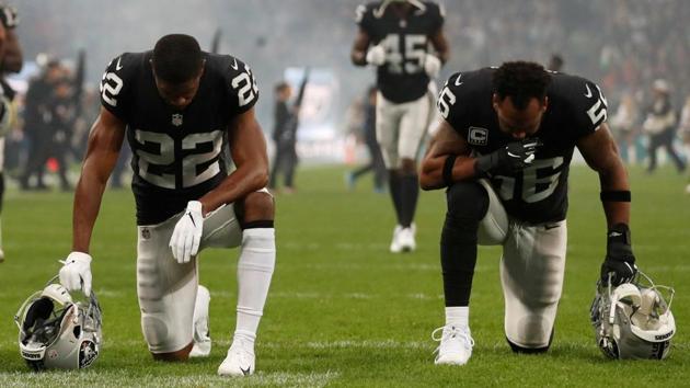 Oakland Raiders’ Rashaan Melvin and Derrick Johnson pray before the Seattle Seahawks v Oakland Raiders game at Wembley Stadium, London, England. (Matthew Childs / Action Images via Reuters)