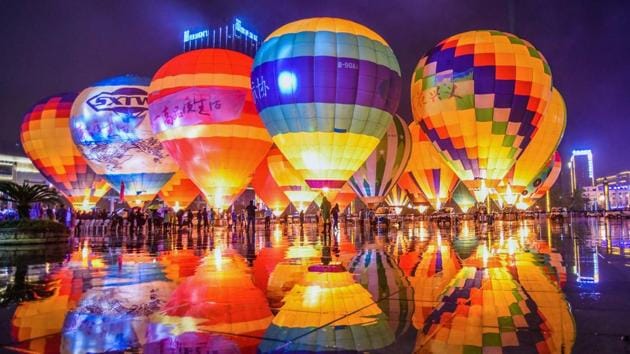 Hot air balloons displayed on a square during the 2018 Outdoor Sports Conference in Xingyi in China’s southwestern Guizhou province. (Stringer / AFP)