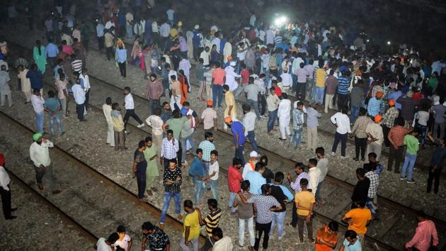 People gather near the site of a train accident at Joda Phatak in Amritsar, Friday, Oct 19, 2018.(PTI)