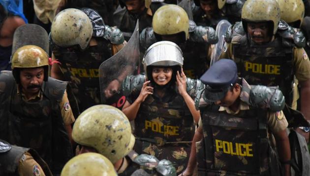 Journalist Kavitha Jakkal being escorted by the police to Sabarimala Temple, Kerala, Friday, Oct 19, 2018. Kavitha and activist Rehana Fathima were taken to the temple but the priest, reportedly, locked it and the women had to return mid-way. (PTI) Journalist Kavitha Jakkal being escorted by the police to Sabarimala Temple, Kerala, Friday, Oct 19, 2018. Kavitha and activist Rehana Fathima were taken to the temple but the priest, reportedly, locked it and the women had to return mid-way. (PTI)