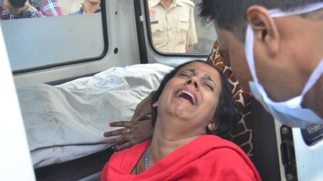A woman cries outside the mortuary at the Amritsar civil hospital. (sameer sehgal)