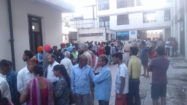 Relatives of those who killed during the train accident wait for the dead bodies outside Amritsar civil hospital’s mortuary house on Saturday. (sameer sehgal)