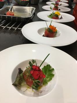 Fresh tomato with eggplant filling, raisins, pine nuts and mixed green salad, one of chef Marc’s signature dishes