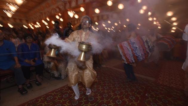 People celebrate Durga Puja at a pandal in Chitranjan Park, New Delhi, India. (Biplov Bhuyan / HT Photo) People celebrate Durga Puja at a pandal in Chitranjan Park, New Delhi, India. (Biplov Bhuyan / HT Photo)