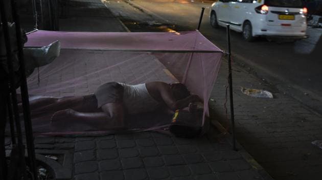 A man sleeps under the cover of a mosquito net in the evening. Zika virus is transmitted through the aedes aegypti mosquito, and causes fever, skin rashes, conjunctivitis, muscle and joint pain.(AP File Photo)