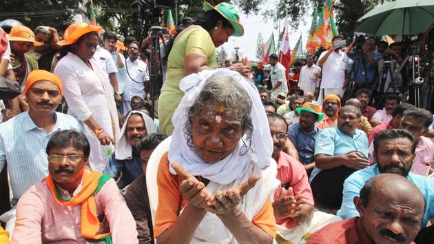 Hindu devotees take part in a protest against a Supreme Court verdict revoking a ban on women’s entry to the Ayyappa temple in Sabarimala, in Thiruvananthapuram, Kerala. The temple -- considered one of the holiest for Hindus -- has traditionally barred all women of menstruating age, between 10 and 50. (Kaviyoor Santosh / AFP) Hindu devotees take part in a protest against a Supreme Court verdict revoking a ban on women’s entry to the Ayyappa temple in Sabarimala, in Thiruvananthapuram, Kerala. The temple -- considered one of the holiest for Hindus -- has traditionally barred all women of menstruating age, between 10 and 50. (Kaviyoor Santosh / AFP)