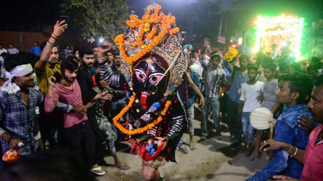 An Indian artist dressed as the Hindu Goddess Kali performs the traditional ‘Kali Swang,’ organised annually by the Daraganj Ramleela committee, in the Daraganj area in Allahabad, Uttar Pradesh. (Sanjay Kanojia / AFP) An Indian artist dressed as the Hindu Goddess Kali performs the traditional ‘Kali Swang,’ organised annually by the Daraganj Ramleela committee, in the Daraganj area in Allahabad, Uttar Pradesh. (Sanjay Kanojia / AFP)