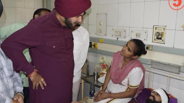 Punjab cabinet minister Navjot Singh Sidhu meets with injured people in the train accident at a Civil Hospital in Amritsar, Punjab, on October 21, 2018. (Sameer Sehgal/HT Photo) Punjab cabinet minister Navjot Singh Sidhu meets with injured people in the train accident at a Civil Hospital in Amritsar, Punjab, on October 21, 2018. (Sameer Sehgal/HT Photo)