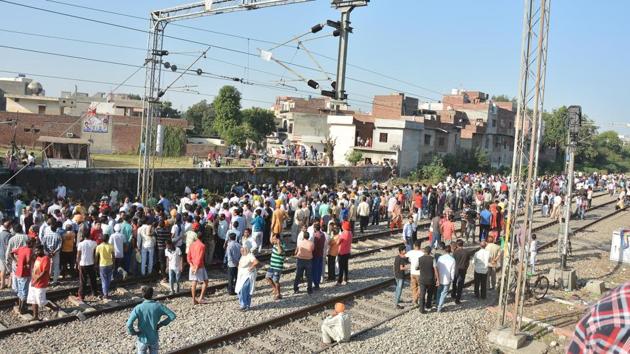 People gather at the scene of an accident along railroad tracks in Amritsar on October 20, 2018, after revelers who gathered on the tracks were killed by a moving train on October 19.(Sameer Sehgal/HT Photo)