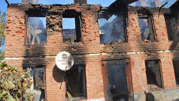 The frame of a house stands after an explosion damaged the building and killed seven civilians in Larro area of Kulgam, about 65 kilometres south of Srinagar in Jammu and Kashmir, on October 21, 2018.(HT Photo) The frame of a house stands after an explosion damaged the building and killed seven civilians in Larro area of Kulgam, about 65 kilometres south of Srinagar in Jammu and Kashmir, on October 21, 2018.(HT Photo)