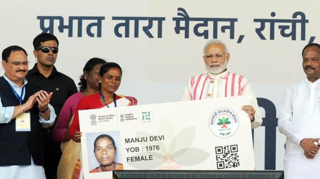 Prime Minister Narendra Modi gives a health card to beneficiaries as he launches Ayushman Bharat-National Health Protection Scheme, in Ranchi, September 23(Parwaz Khan/ Hindustan Times)