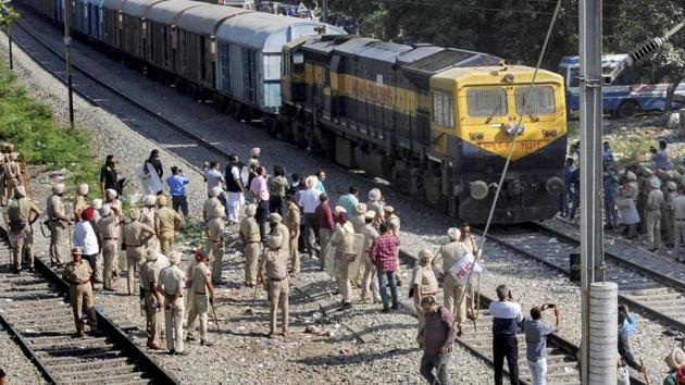 Security on high alert as the first train passes by before resumption of railway services since the train accident, in Amritsar, on October 21, 2018.(PTI)