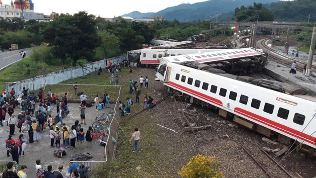 This CNA handout picture taken on October 21, 2018 shows a derailed train in Yian, eastern Taiwan.(AFP)
