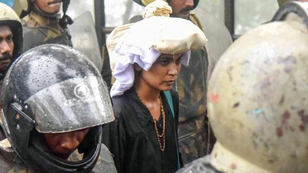 Activist Rehana Fathima being escorted by the police to Sabarimala Temple, Kerala, Friday, Oct 19, 2018.(PTI)