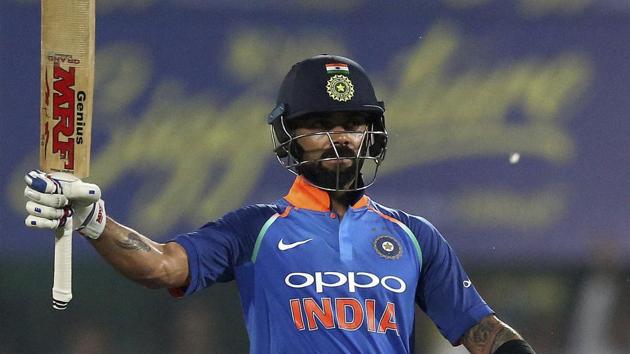 India's captain Virat Kohli raises his bat to celebrate scoring century. (AP)