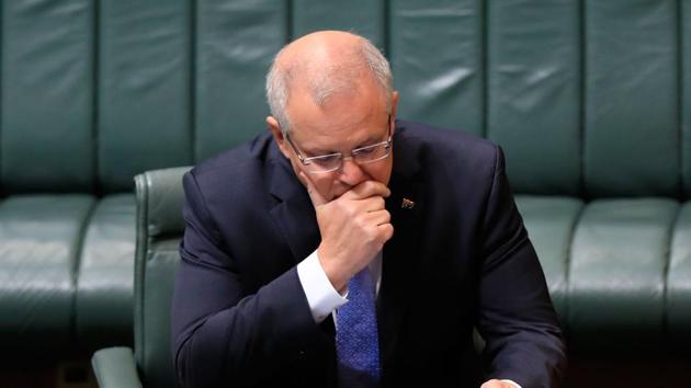 Australia's Prime Minister Scott Morrison prepares issued a national apology to victims of child sex abuse in an emotional address to parliament October 22, acknowledging the state failed to stop "evil dark crimes" committed over decades. (Photo by Sean Davey / AFP) (AFP) Australia's Prime Minister Scott Morrison prepares issued a national apology to victims of child sex abuse in an emotional address to parliament October 22, acknowledging the state failed to stop "evil dark crimes" committed over decades. (Photo by Sean Davey / AFP) (AFP)