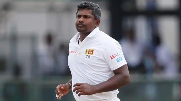 Sri Lanka's Rangana Herath celebrates after taking the wicket of South Africa's Quinton de Kock.