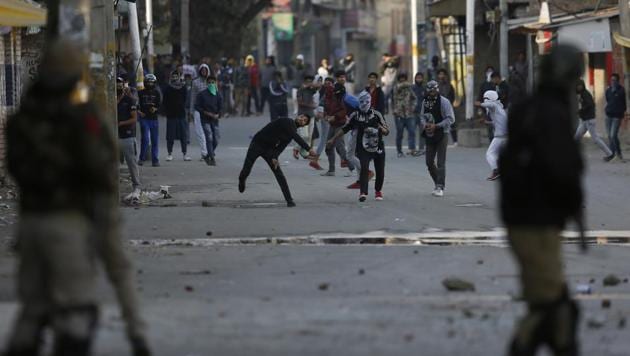 Kashmiri protesters throw stones on policemen during a protest in Srinagar, Monday, Oct. 22, 2018. (AP) Kashmiri protesters throw stones on policemen during a protest in Srinagar, Monday, Oct. 22, 2018. (AP)