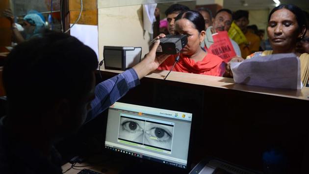 A Supreme Court order said Aadhaar Act’s Section 57 that allows firms to collect data by “contract” is unconstitutional. (AFP File Photo) A Supreme Court order said Aadhaar Act’s Section 57 that allows firms to collect data by “contract” is unconstitutional. (AFP File Photo)