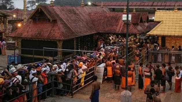 Hindu devotees wait in queues inside the premises of the Sabarimala temple in Pathanamthitta district in Kerala on October 18.(REUTERS)