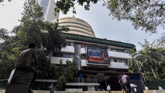 People watch share prices on a digital broadcast outside the Bombay Stock Exchange (BSE) in Mumbai on October 11. (Kunal Patil/HT File Photo) People watch share prices on a digital broadcast outside the Bombay Stock Exchange (BSE) in Mumbai on October 11. (Kunal Patil/HT File Photo)