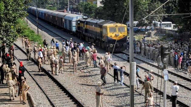 Security on high alert as the first train passes by before resumption of railway services since the train accident, in Amritsar, Sunday, Oct 21, 2018.(PTI)