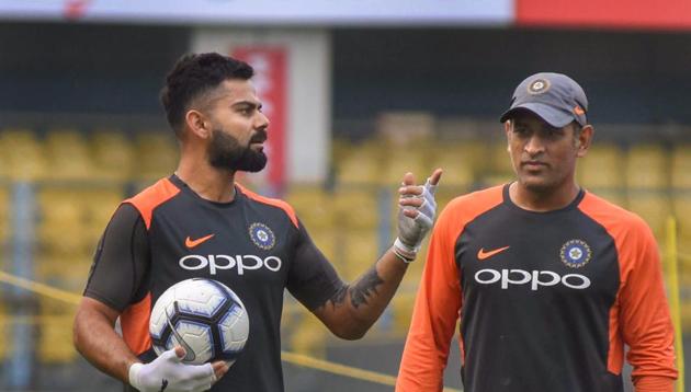 Guwahati: Team India captain Virat Kohli and MS Dhoni during a practice session ahead of the first One Day International cricket match against West Indies, at ACA Cricket Stadium, Barsapara in Guwahati(PTI)