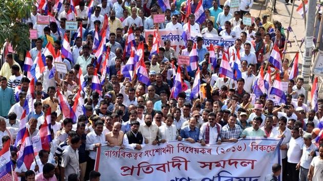 Members of Asom Gana Parishad (AGP) take out a protest rally against the Centre’s bid to pass the Citizenship (Amendment) Bill, 2016, in Guwahati. On Tuesday morning, protesters burnt tyres, disrupted vehicular and rail traffic at several places in the state during a 12-hour shutdown called by 46 indigenous groups in Assam against the proposed Citizenship (Amendment) Bill. (Rajib Jyoti Sarma / HT Photo) 