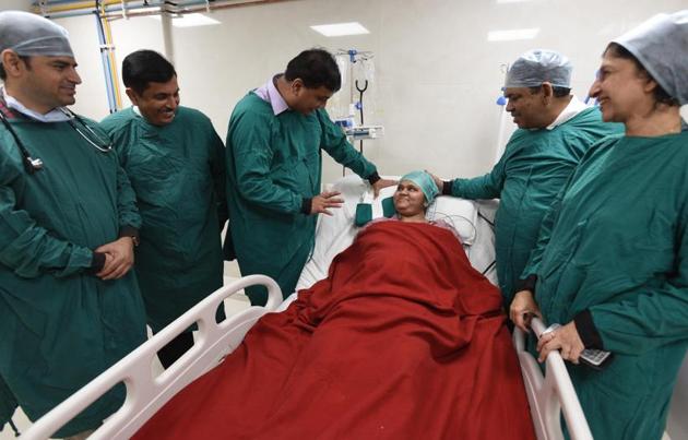 Core team of doctors L to R - Dr Bhushan Kinholkar, Dr Milind Telang, Dr Shailesh Puntambekar,Dr Pankaj Kulkarni and Dr Seema Puntambekar with Meenakshi Valand,the first woman in India to give birth to a baby, via C-section,from a uterus transplanted within her at Galaxy hospital on Karve road in Pune. (Pratham Gokhale/HT Photo) Core team of doctors L to R - Dr Bhushan Kinholkar, Dr Milind Telang, Dr Shailesh Puntambekar,Dr Pankaj Kulkarni and Dr Seema Puntambekar with Meenakshi Valand,the first woman in India to give birth to a baby, via C-section,from a uterus transplanted within her at Galaxy hospital on Karve road in Pune. (Pratham Gokhale/HT Photo)