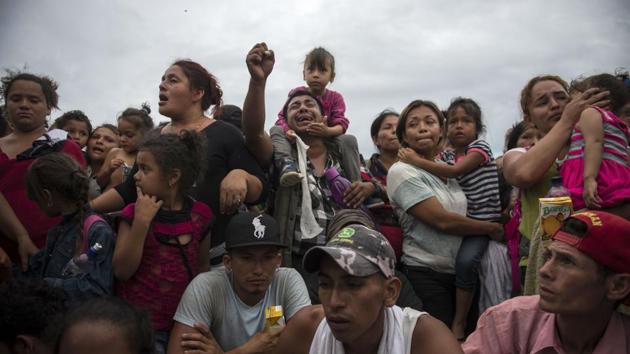 Ana Luisa Espana, a laundry worker from Guatemala, joined the caravan as she saw it pass through. Even though the goal is to reach the US border, she said: “We only want to work and if a job turns up in Mexico, I would do it. We would do anything, except bad things.” Denis Omar Contreras, a Honduran-born caravan leader also with Pueblo Sin Fronteras, said accusations that the caravan is harboring terrorists should stop. (Oliver de Roos / AP) Ana Luisa Espana, a laundry worker from Guatemala, joined the caravan as she saw it pass through. Even though the goal is to reach the US border, she said: “We only want to work and if a job turns up in Mexico, I would do it. We would do anything, except bad things.” Denis Omar Contreras, a Honduran-born caravan leader also with Pueblo Sin Fronteras, said accusations that the caravan is harboring terrorists should stop. (Oliver de Roos / AP)