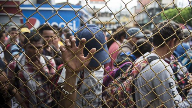 Some have questioned the timing and whether political force was behind it, though by all appearances it began as a group of about 160 banding together in Honduras for protection and snowballed as they moved north. “No one is capable of organizing this many people,” Irineo Mujica of the group Pueblo Sin Fronteras said, adding that there are only two forces driving them: “hunger and death.” (Oliver de Roos / AP) Some have questioned the timing and whether political force was behind it, though by all appearances it began as a group of about 160 banding together in Honduras for protection and snowballed as they moved north. “No one is capable of organizing this many people,” Irineo Mujica of the group Pueblo Sin Fronteras said, adding that there are only two forces driving them: “hunger and death.” (Oliver de Roos / AP)