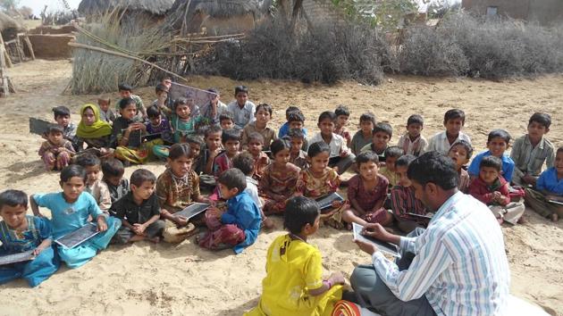 Children studying in an open classroom in a village in Rajasthan’s Barmer. (File photo)(HT Photo)