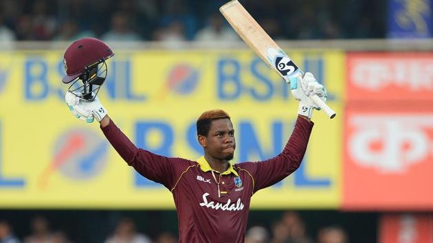 West Indies batsman Shimron Hetmyer raises his bat and helmet after he completed his century (100 runs) during the first one day international (ODI) cricket match between India and West Indies(AFP) West Indies batsman Shimron Hetmyer raises his bat and helmet after he completed his century (100 runs) during the first one day international (ODI) cricket match between India and West Indies(AFP)
