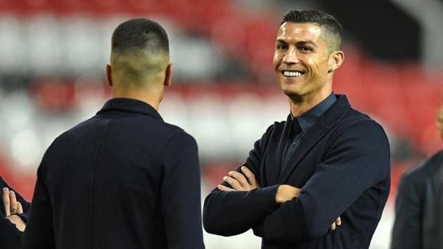 Juventus striker Cristiano Ronaldo joins teammates during a walkabout inside the Old Trafford Stadium in Manchester. (AFP) Juventus striker Cristiano Ronaldo joins teammates during a walkabout inside the Old Trafford Stadium in Manchester. (AFP)