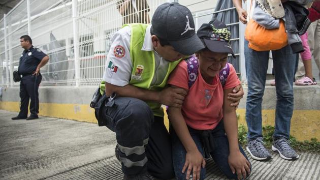 A Honduran migrant is comforted by a Mexican paramedic after her mother fainted. Caravan leaders have not defined the precise route or decided where on the US border they want to arrive, but in recent years most Central American migrants on their own have opted for the most direct route, which takes them to Reynosa, across from McAllen. (Oliver de Roos / AP) A Honduran migrant is comforted by a Mexican paramedic after her mother fainted. Caravan leaders have not defined the precise route or decided where on the US border they want to arrive, but in recent years most Central American migrants on their own have opted for the most direct route, which takes them to Reynosa, across from McAllen. (Oliver de Roos / AP)