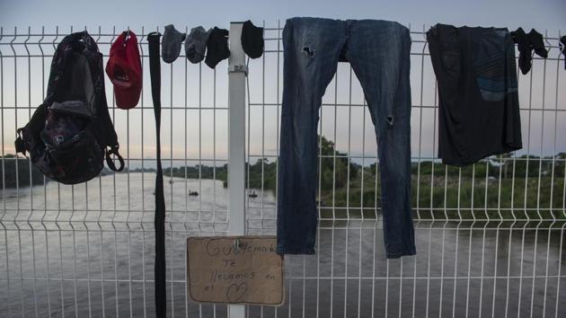 Clothes belonging to a migrant hang to dry on the fence of a border bridge. A team of AP journalists travelling with the caravan for more than a week has spoken with Hondurans, Guatemalans and Salvadorans, but has not met any Middle Easterners, who Trump suggested were “mixed in” with the migrants. It was clear, though, that more migrants were continuing to join the caravan. (Oliver de Roos / AP) Clothes belonging to a migrant hang to dry on the fence of a border bridge. A team of AP journalists travelling with the caravan for more than a week has spoken with Hondurans, Guatemalans and Salvadorans, but has not met any Middle Easterners, who Trump suggested were “mixed in” with the migrants. It was clear, though, that more migrants were continuing to join the caravan. (Oliver de Roos / AP)