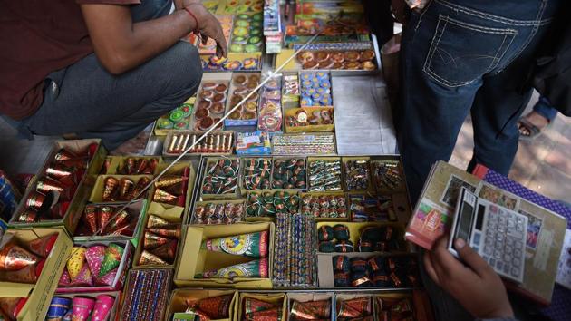 Customers visit a firecracker shop in New Delhi on October 23, 2018(AFP File Photo/Representative Image)