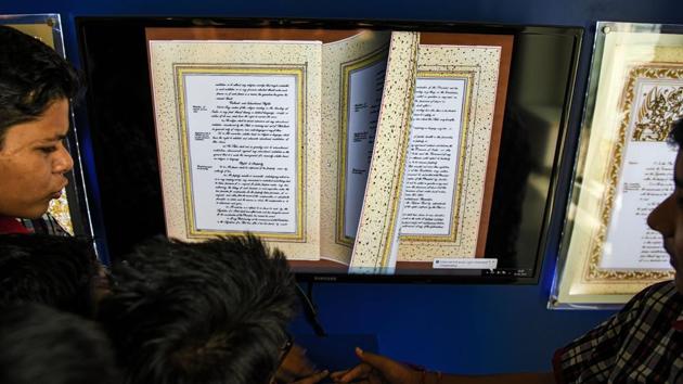 Students flip through a digital copy of the constitution of India.“We have used augmented technology to keep visitors involved and interested. The museum is always a work in progress and we will add more exhibits as we discover them,” said Bordoloi. (Chandan Khanna / AFP) 