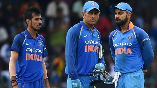 Indian captain Virat Kohli (R) chats with wicketkeeper Mahendra Singh Dhoni (C) and Yuzvendra Chahal during the final one day international (ODI) cricket match between Sri Lanka and India at R. Premadasa Stadium in Colombo on September 3, 2017. (AFP/Getty Images) Indian captain Virat Kohli (R) chats with wicketkeeper Mahendra Singh Dhoni (C) and Yuzvendra Chahal during the final one day international (ODI) cricket match between Sri Lanka and India at R. Premadasa Stadium in Colombo on September 3, 2017. (AFP/Getty Images)