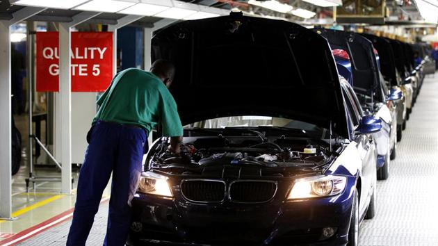 A worker inspects cars at BMW's manufacturing plant in Rosslyn, outside Pretoria (Reuters File)