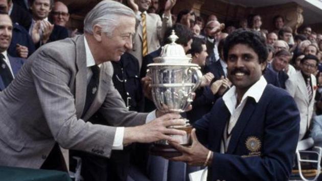 The captain of India, Kapil Dev, receives the Prudential World Cup Trophy from the Chairman of Prudential Assurance, Lord Carr of Hadley, after India's victory over the West Indies in the World Cup Final at Lord's cricket ground in London, 25th June 1983. India won by 43 runs.(Bob Thomas/Getty Images)