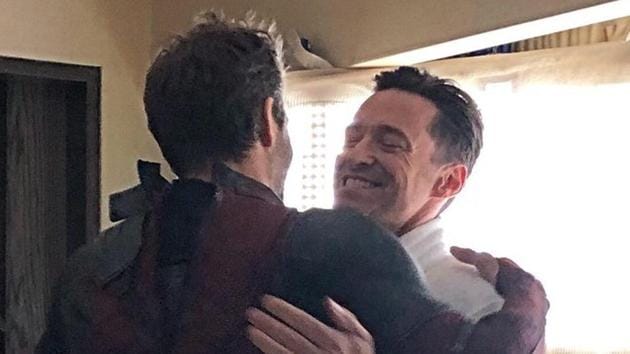 Ryan Reynolds and Hugh Jackman hug it out.