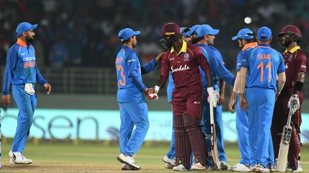 Indian cricket captain Virat Kohli (L) and teammates greet West Indies batsmen after a tied at the end of the second one day international (ODI) cricket match between India and West Indies tied at the Dr. Y.S. Rajasekhara Reddy ACA-VDCA Cricket Stadium in Visakhapatnam (AFP)