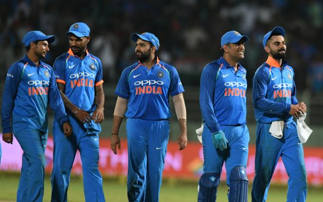 Indian cricket captain Virat Kohli (R) leaves the field with teammates after they tied against West Indies during the second one day international (ODI) cricket match between India and West Indies at the Dr. Y.S. Rajasekhara Reddy ACA-VDCA Cricket Stadium in Visakhapatnam. (AFP)