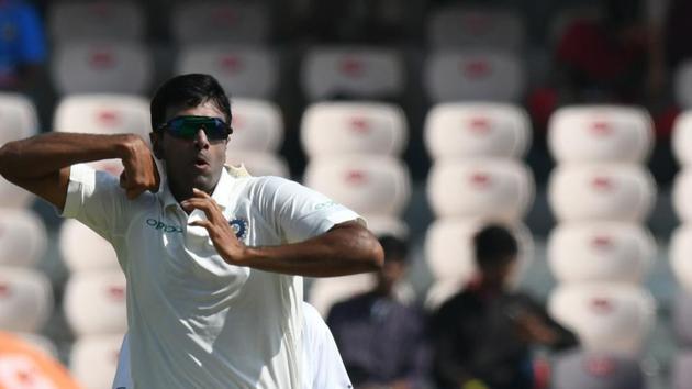 Indian cricketer Ravichandran Ashwin bowls during the first day's play of the second Test cricket match between India and West Indies at the Rajiv Gandhi International Cricket Stadium in Hyderabad on October 12, 2018.(AFP)