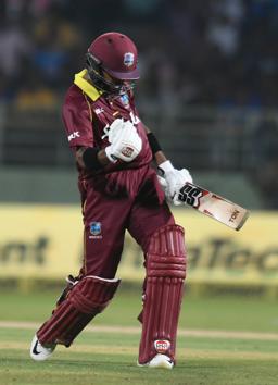 West Indies cricketer Shai Hope celebrates after scoring a century (100 runs) during the second one day international (ODI) cricket match between India and West Indies at the Dr. Y.S. Rajasekhara Reddy ACA-VDCA Cricket Stadium in Visakhapatnam. (AFP)